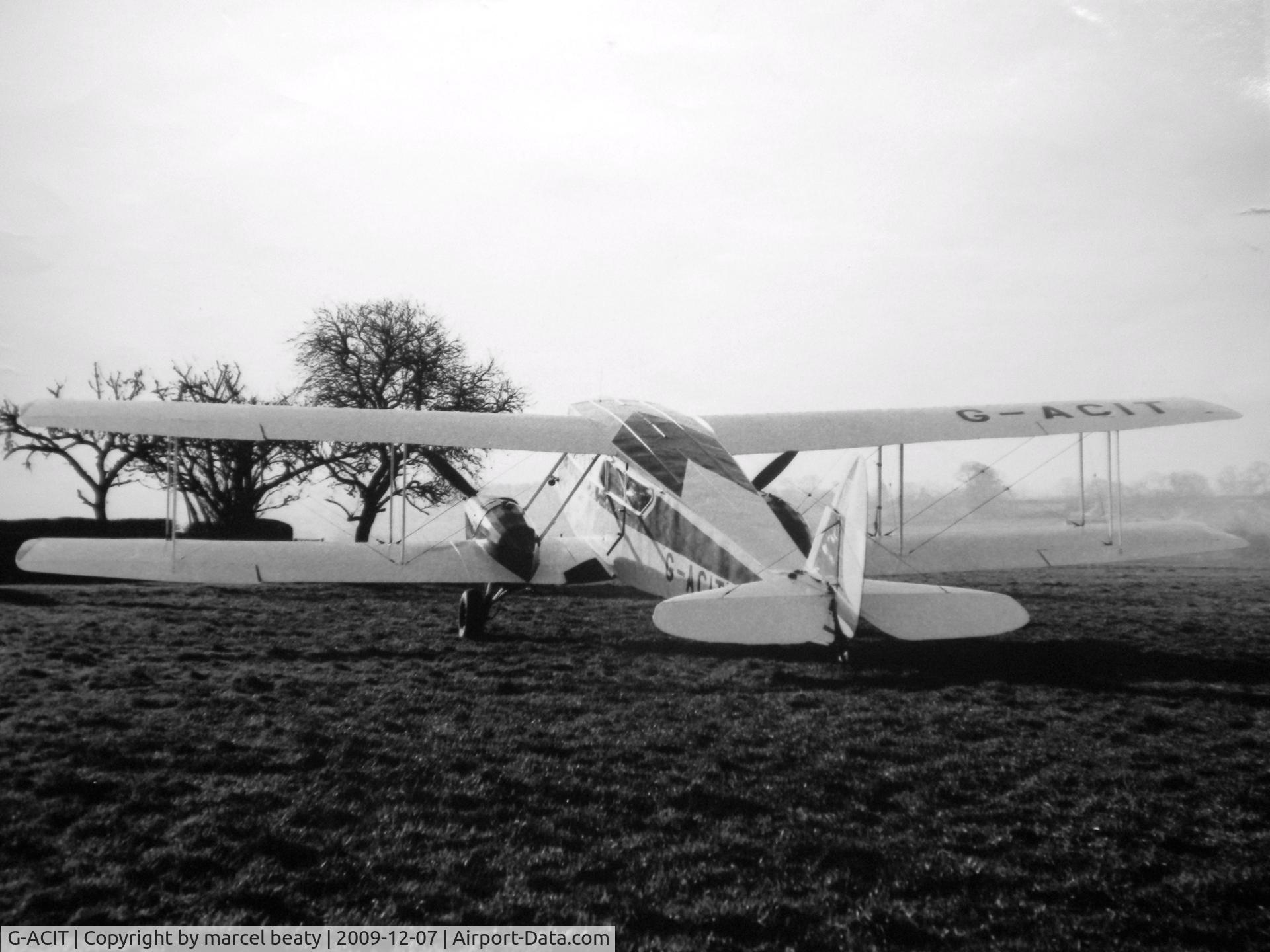 G-ACIT, 1933 De Havilland DH-84 Dragon 1 C/N 6039, parked at drayton home farm slipton at owners airstrip where aircraft was hangared 1969