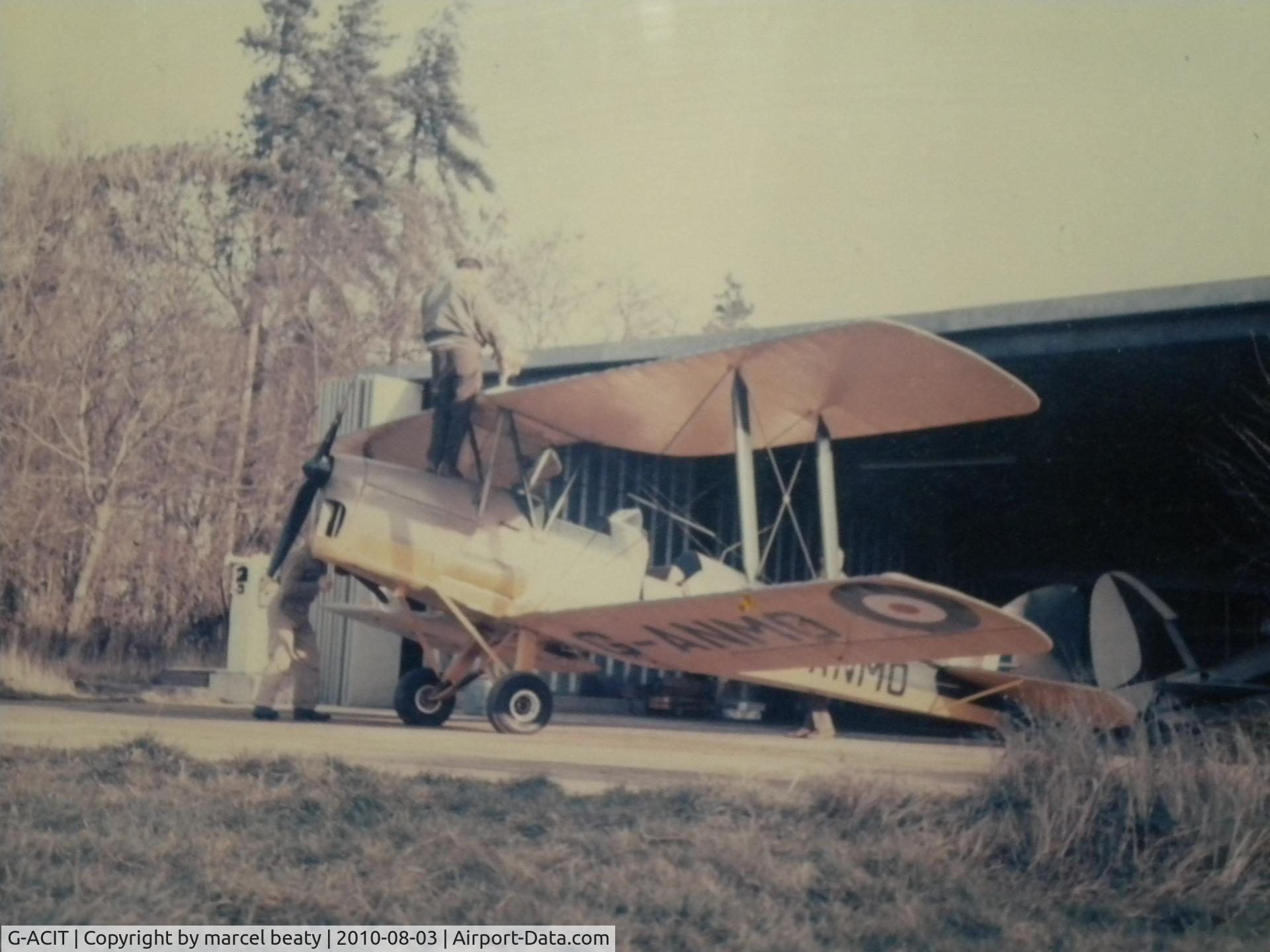 G-ACIT, 1933 De Havilland DH-84 Dragon 1 C/N 6039, slipton northants.1969. you can just see g-acit ,s tail in the hangar where it was kept by owner of the time the late john beaty before selling it to southend museum in the early 70,s