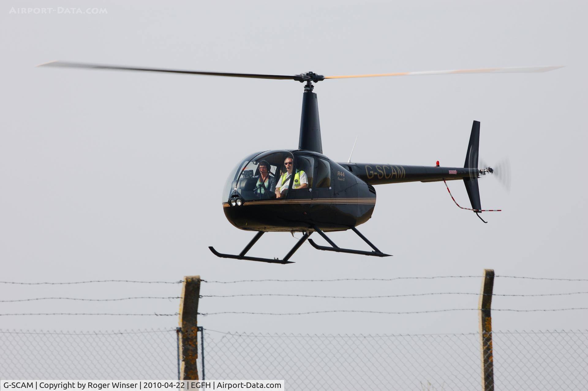 G-SCAM, 2004 Robinson R44 Raven II C/N 10329, Arriving Runway 22. Deregistered on 25th May 2010 and subsequently registered F-OIAS.