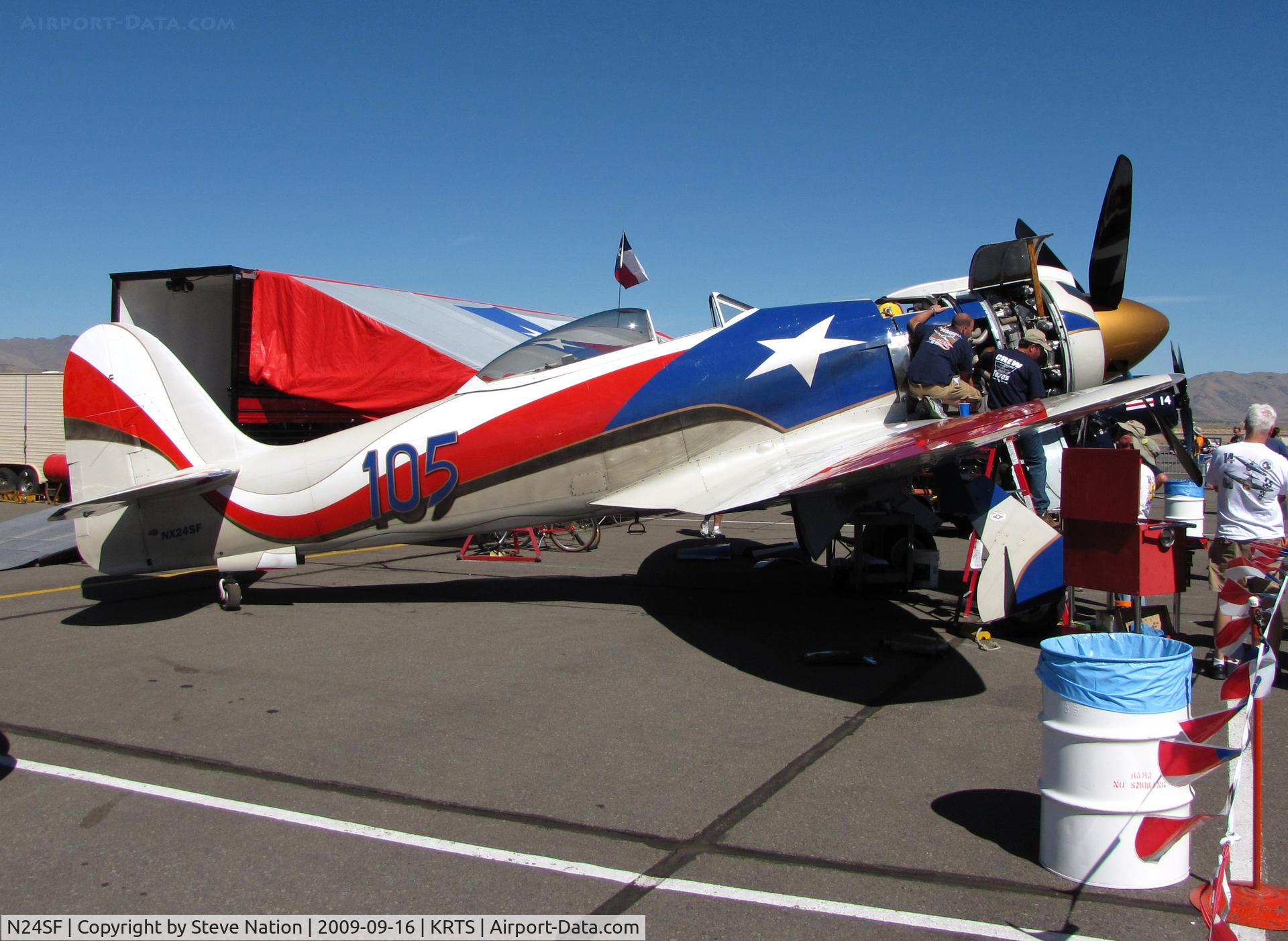 N13HP, 1953 Hawker Sea Fury ISS-25 C/N 37536, Race #105 1948 Hawker Sea Fury Unlimited Class @ Reno Air Races with ground crew working on that big oi' engine!