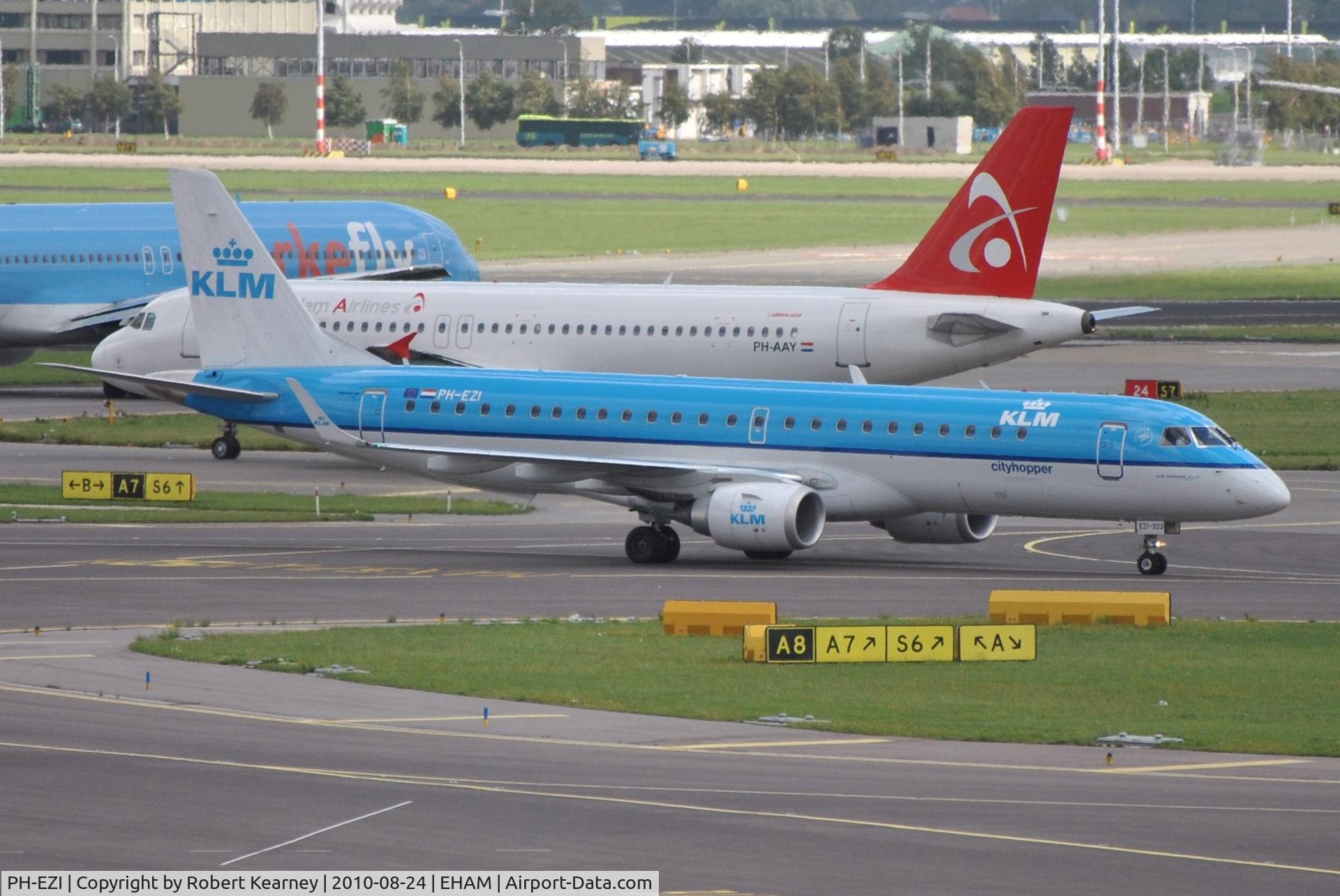 PH-EZI, 2009 Embraer 190LR (ERJ-190-100LR) C/N 19000322, KLM cityhopper taxiing in with a queue of departures behind