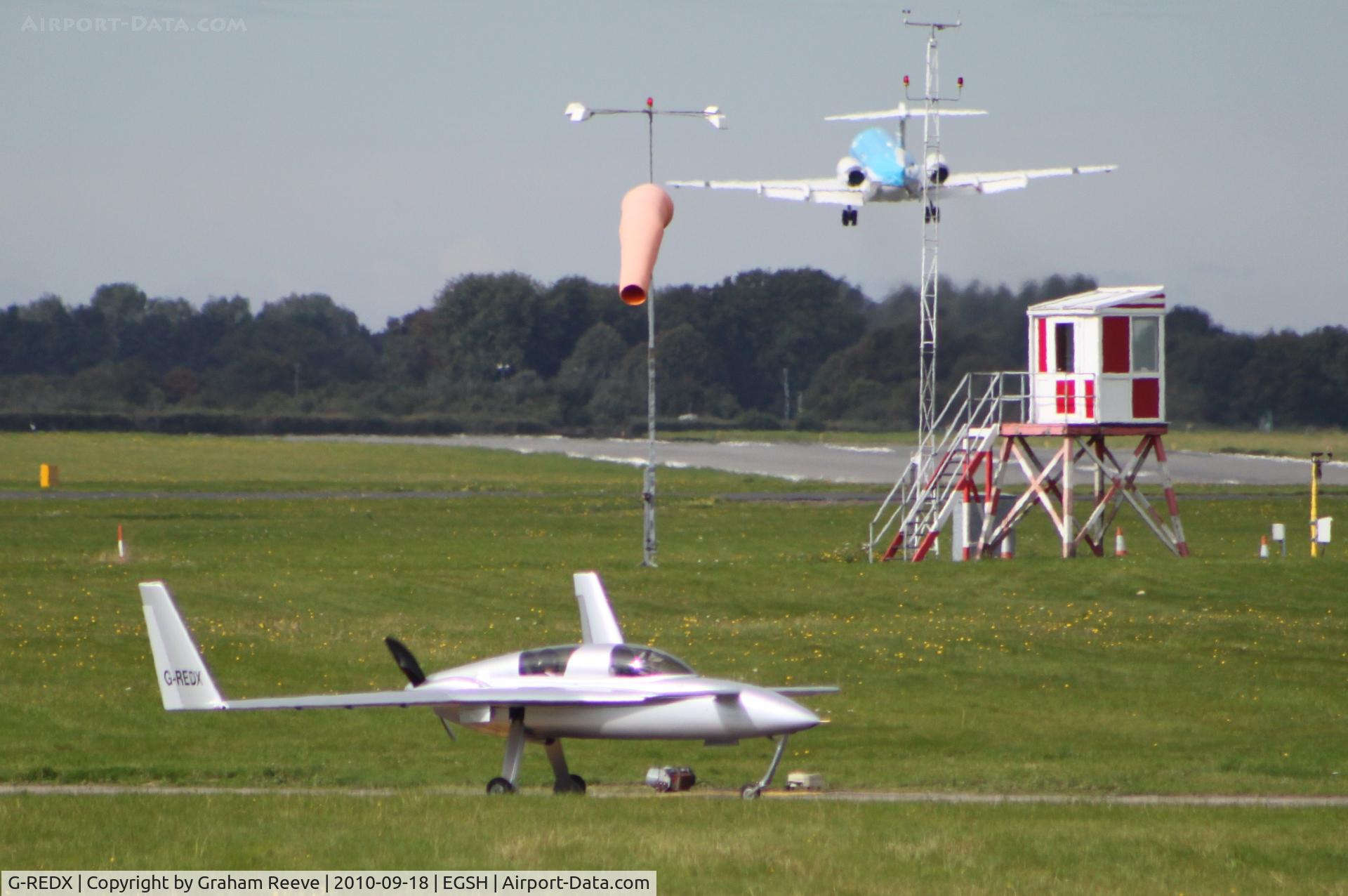 G-REDX, 1999 Berkut 360 C/N PFA 252-12481, PH-KZL, KLM Fokker 70 taking off in the back ground.