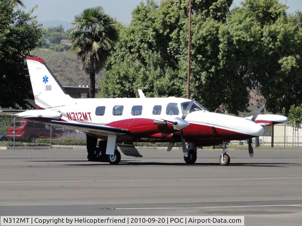 N312MT, 1982 Piper PA-31T2 Cheyenne IIXL C/N 31T-8166062, Appears to be waiting for someone to arrive, notice EMT insignia on tail