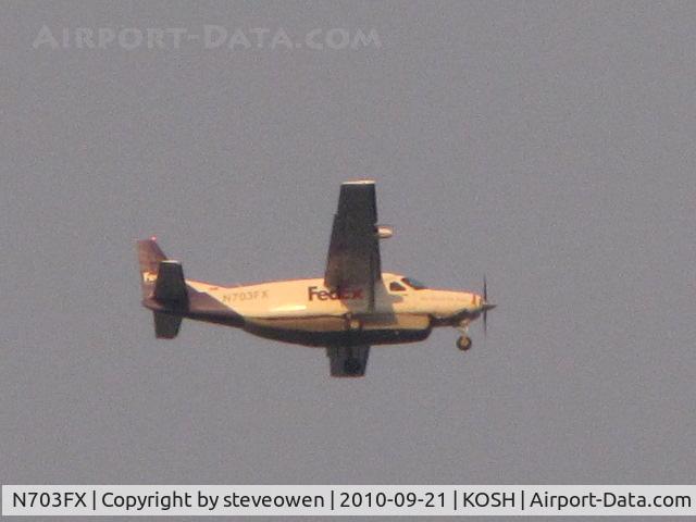 N703FX, 1994 Cessna 208B C/N 208B0423, Taken when flying overhead into the setting sun KOSH