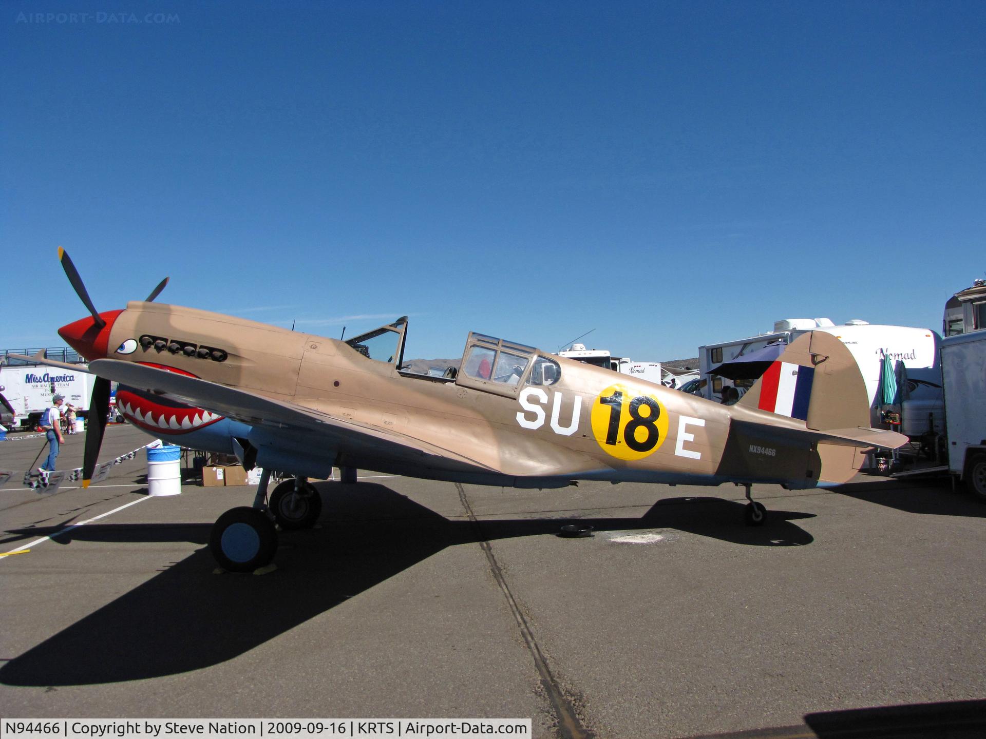 N94466, 1942 Curtiss P-40E C/N AK-899, Race #18 is a sharkmouth P-40E (as NX94466) with desert camo and 