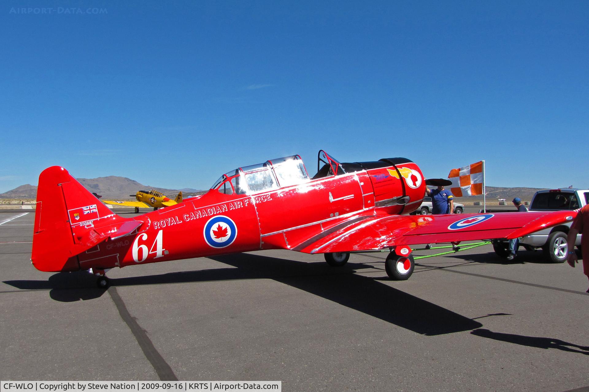 CF-WLO, 1945 Canadian Car & Foundry T-6 Harvard Mk.4 C/N CCF4-55, Race #64 is a CCF Harvard Mk. IV in Royal Canadian Air Force Red Knights colors being towed to active ramp for T-6 Class racing @ 2009 Reno Air Races