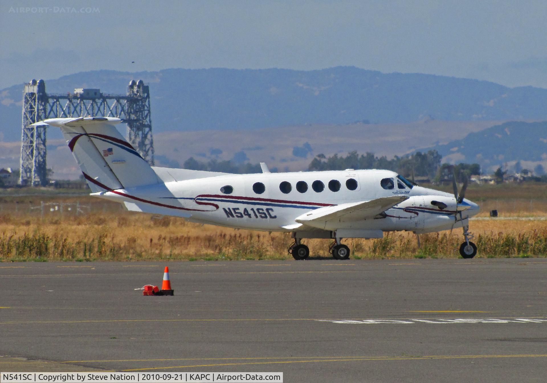 N541SC, 1987 Beech 300 C/N FA-138, 1987 Beech 300 departing Napa, CA (KAPC) with Napa River RR bridge in background