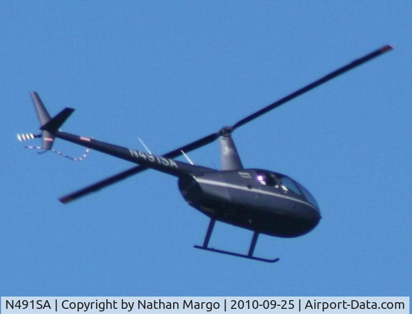 N491SA, Robinson R44 II C/N 12831, Seen flying North over Ocean Beach Jetty, San Diego, California.
