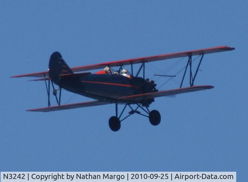 N3242, 1927 Curtiss-Wright Travel Air 4000 C/N 256, Seen flying North over Ocean Beach, San Diego, California.