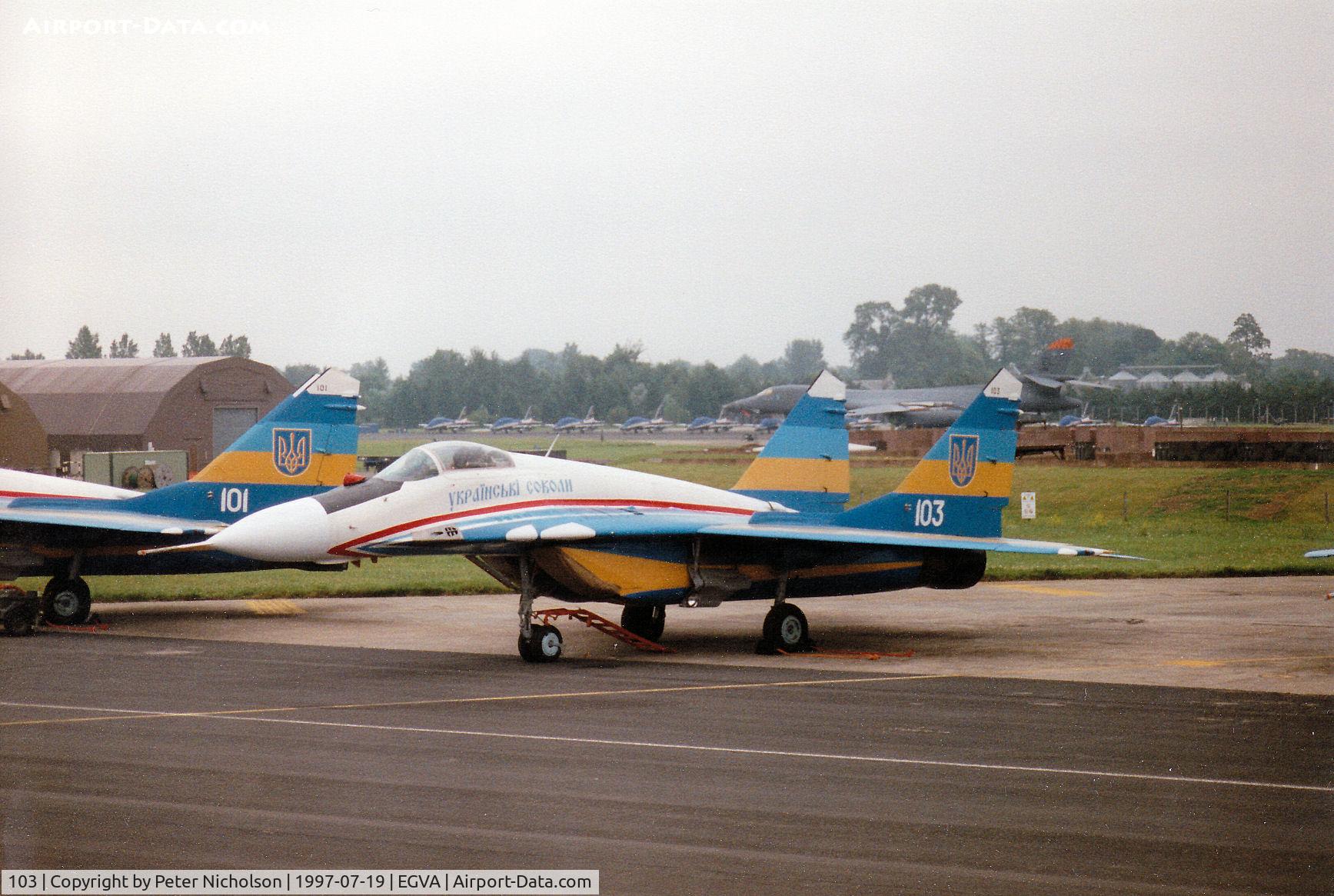 103, Mikoyan-Gurevich MiG-29A C/N 31227, MiG-29A Fulcrum of the Ukranian Falcons display team on the flight-line at the 1997 Intnl Air Tattoo at RAF Fairford.