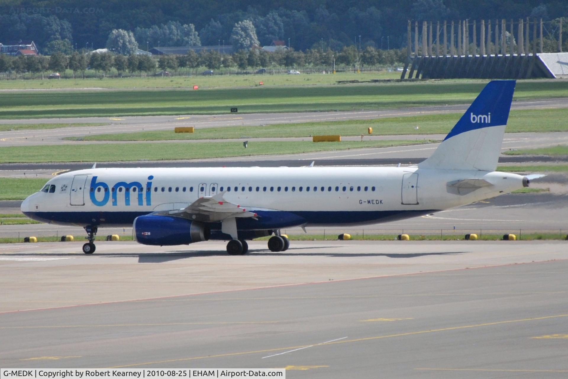 G-MEDK, 2005 Airbus A320-232 C/N 2441, BMI rolling onto remote stand