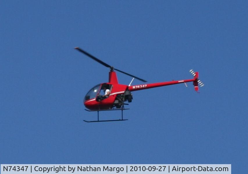 N74347, 2005 Robinson R22 Beta C/N 3759, Seen flying South over Ocean Beach Pier, San Diego, California.