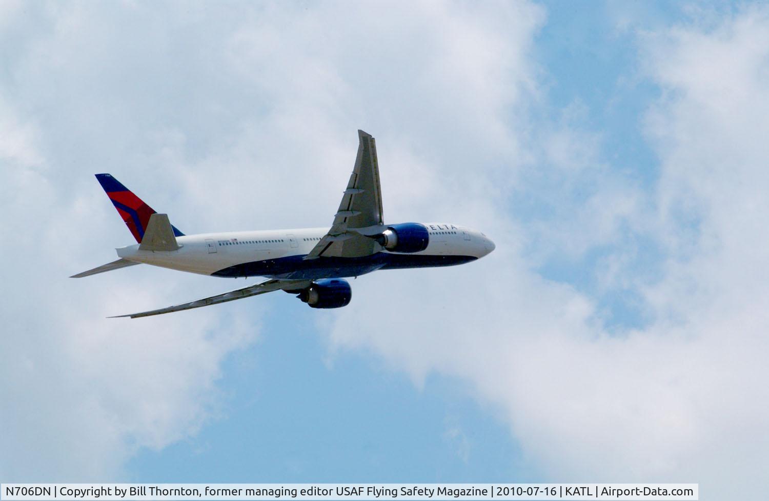 N706DN, Boeing 777-232/LR C/N 30440, A Boeing 777 departs ATL from Rwy 27L. (an f-stop 5.6 photograph)