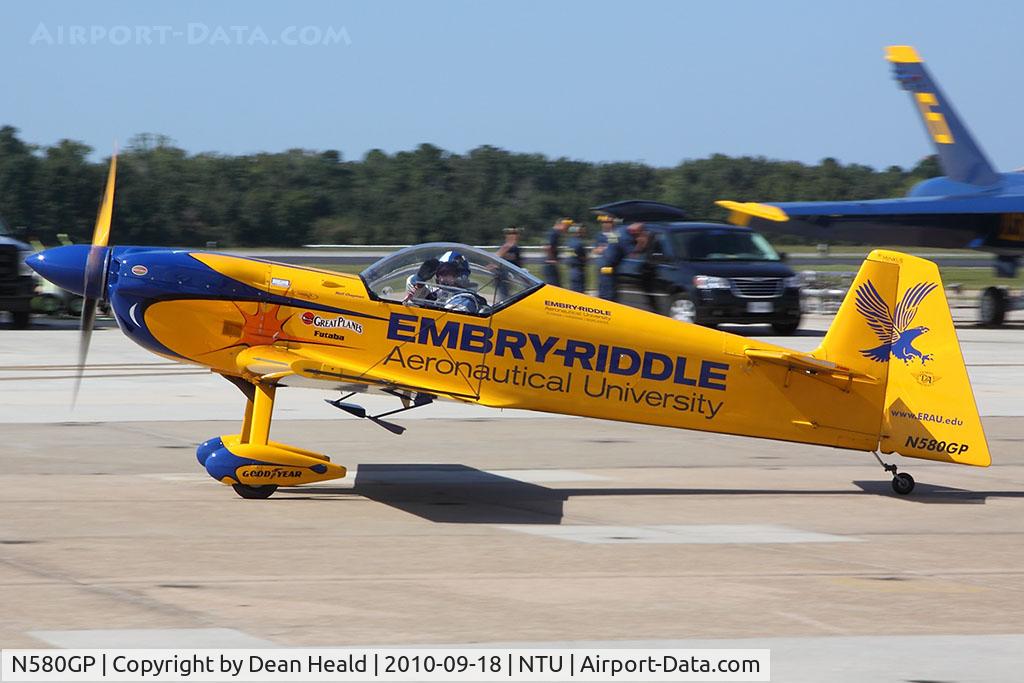 N580GP, 1992 Mudry CAP-231EX C/N 03, Matt Chapman acknowledges the crowd's appreciation of his spectacular aerobatic performance as he taxis before them.