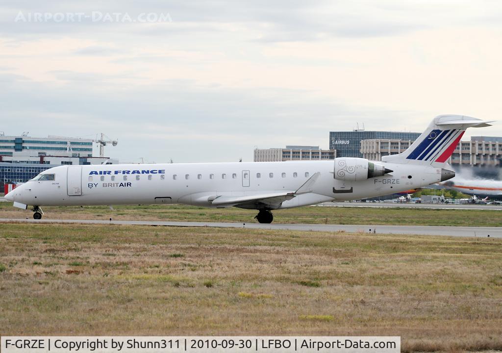 F-GRZE, 2001 Canadair CRJ-702 (CL-600-2C10) Regional Jet C/N 10032, Taxiing holding point rwy 32R for departure with new midified titles and logo...