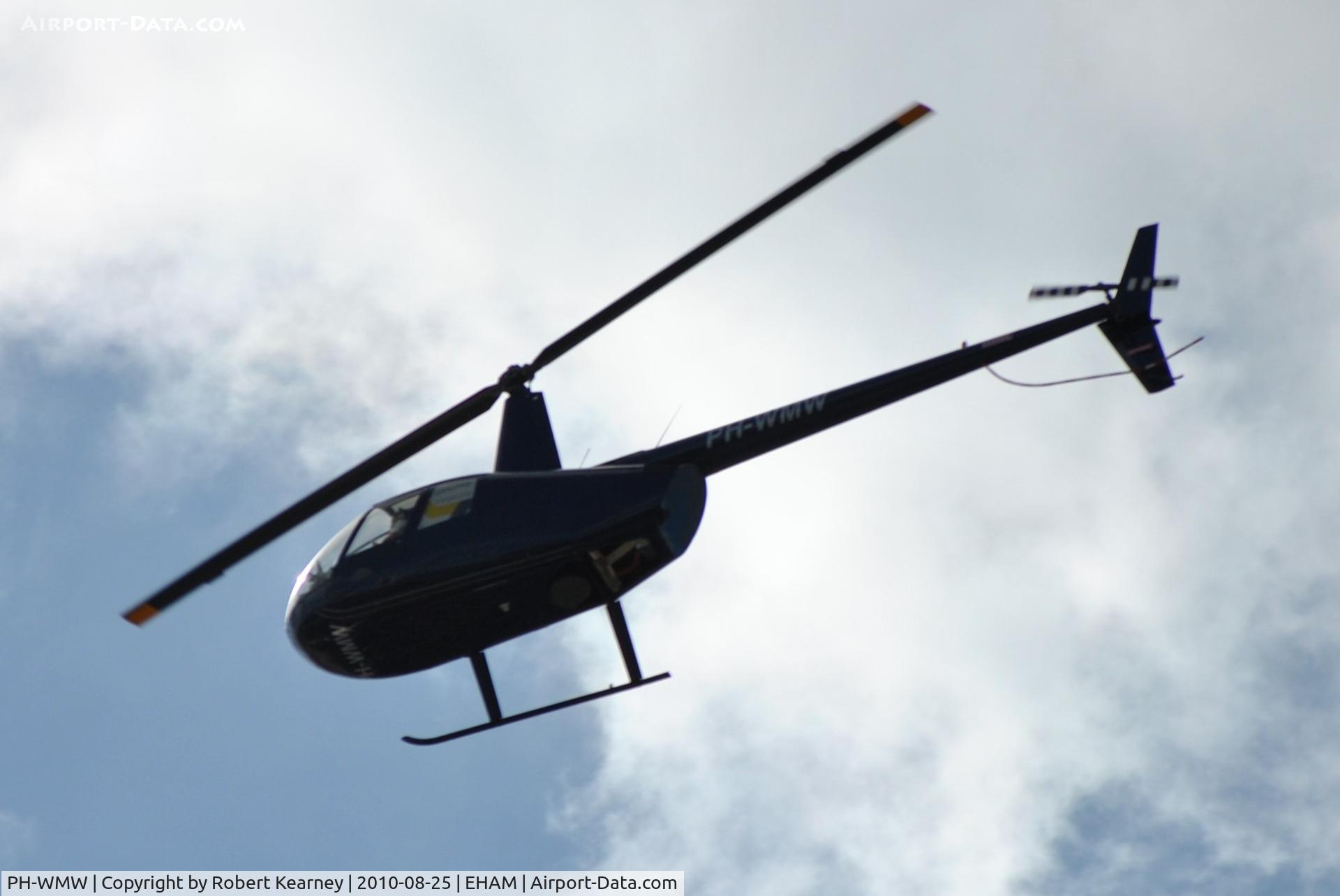 PH-WMW, Robinson R44 Raven I C/N 2072, R44 flying over
