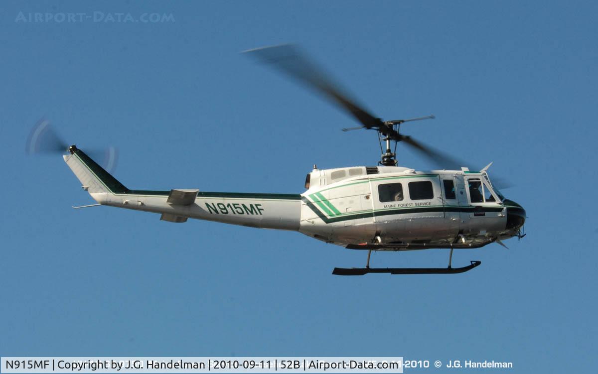 N915MF, Bell UH-1H Iroquois C/N 65-9750, over Greenville Maine