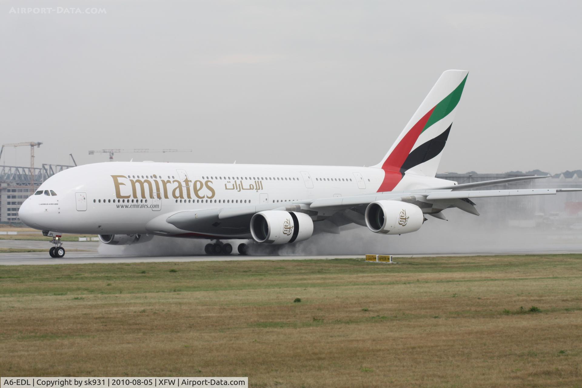 A6-EDL, 2010 Airbus A380-861 C/N 046, very wet day at XFW