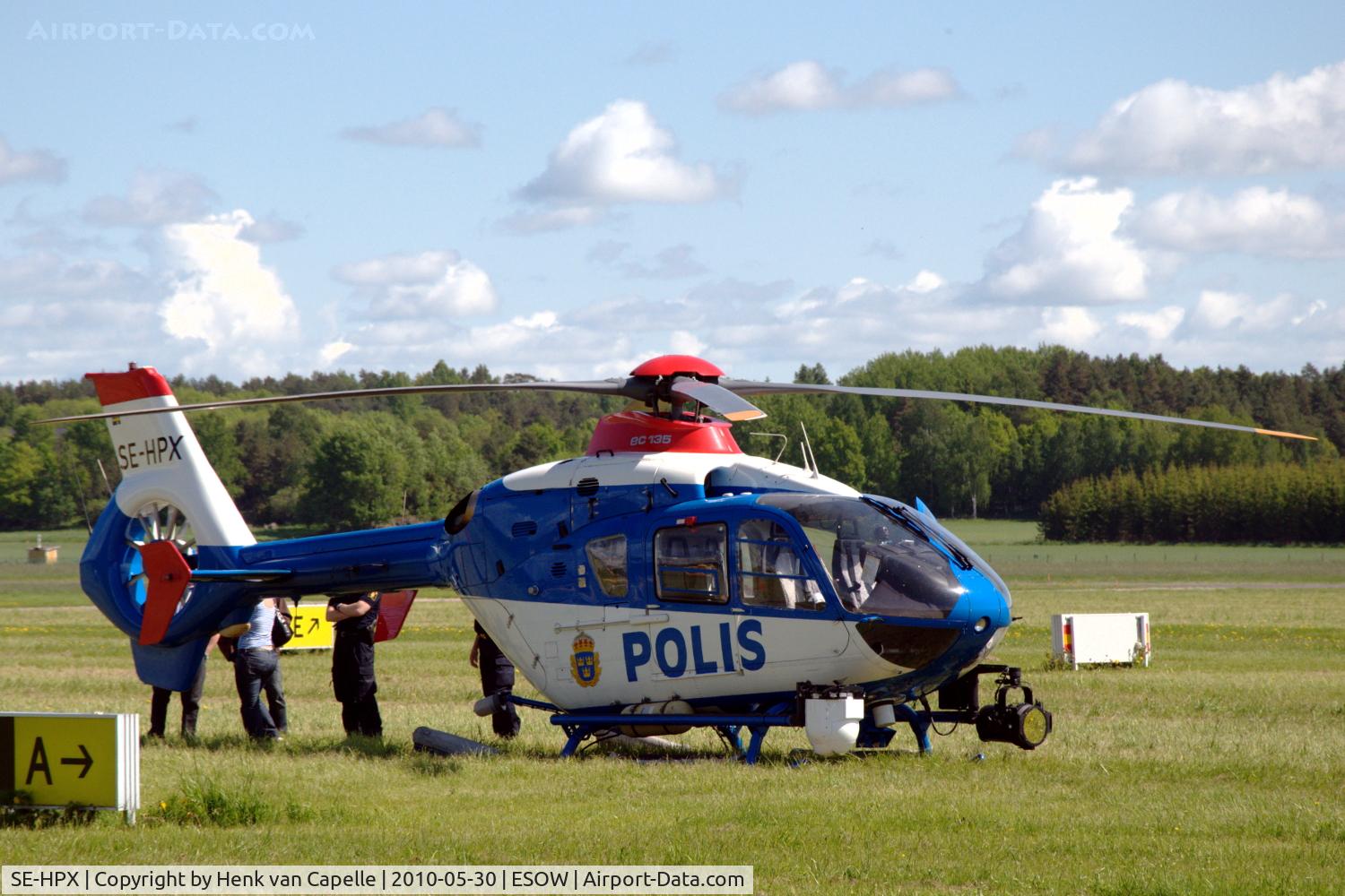 SE-HPX, 2002 Eurocopter EC-135P-2+ C/N 0240, A police EC135 parked in the grass at Västerås Hässlö airport, Sweden.