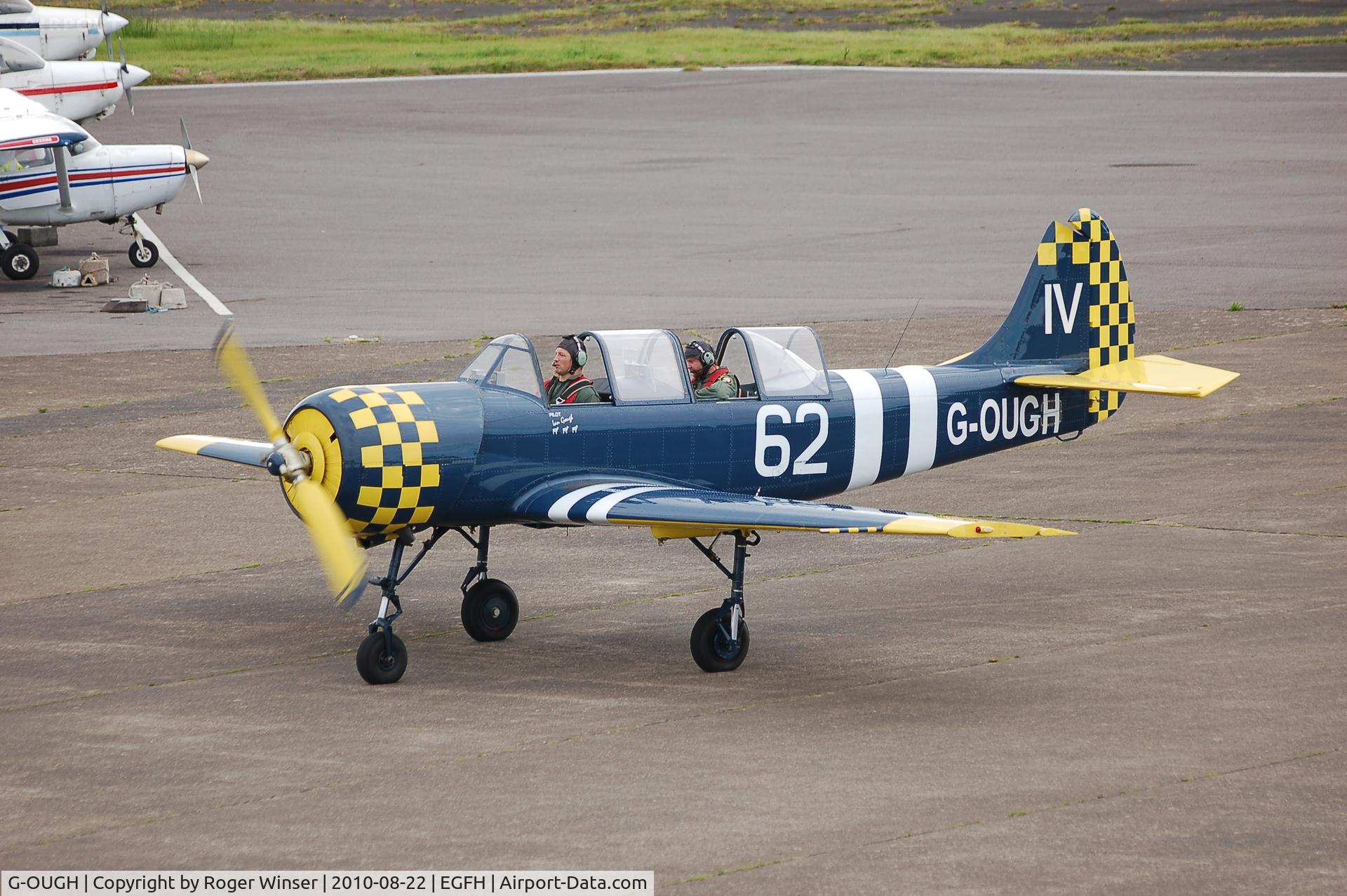 G-OUGH, 1987 Bacau Yak-52 C/N 877404, Based at Swansea Airport. Marked 74/JA on starboard side 