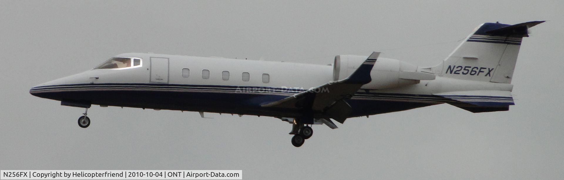 N256FX, Learjet 60 C/N 257, On final to runway 26R on a very overcast day