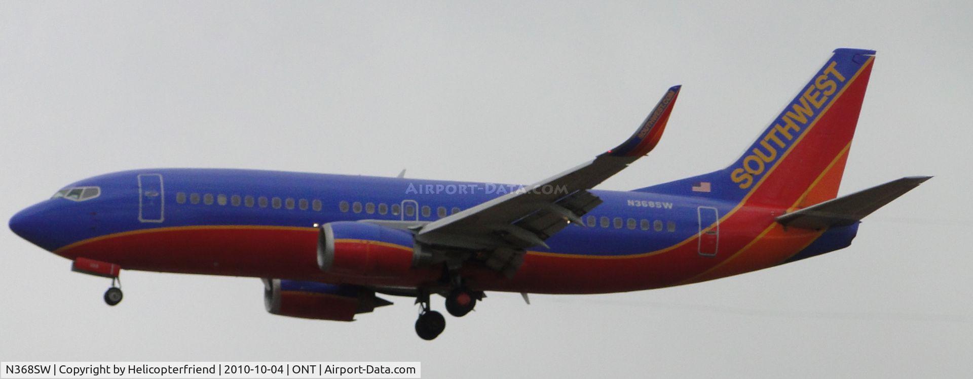 N368SW, 1993 Boeing 737-3H4 C/N 26579, On final to runway 26R