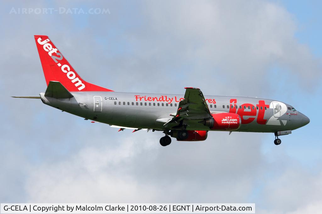 G-CELA, 1986 Boeing 737-377(QC) C/N 23663, Boeing 737-377 on finals to runway 07 at Newcastle Airport in August 2010.