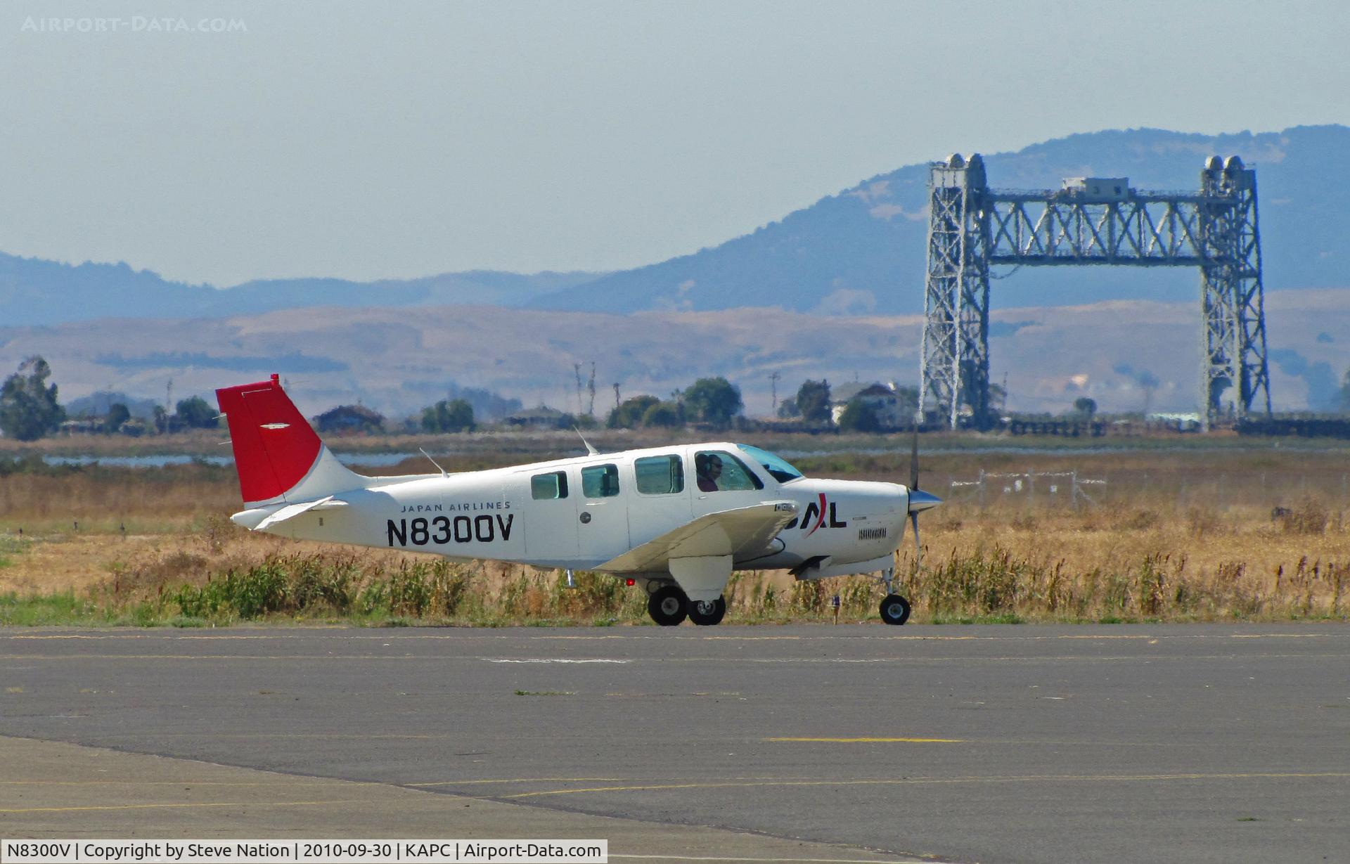N8300V, 1992 Beech A36 Bonanza 36 C/N E-2767, Japan Airlines 1992 Beech A36 (now in new colors) taxiing by Napa River RR bridge