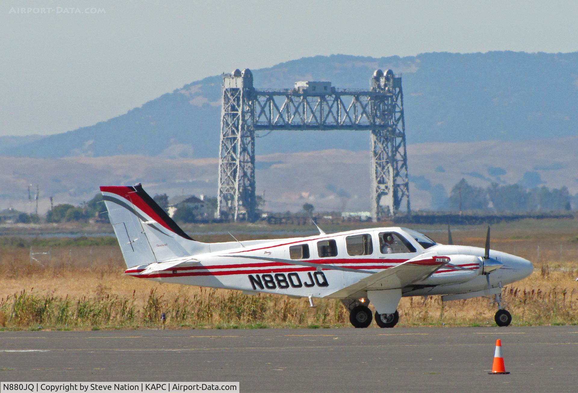 N880JQ, Raytheon Aircraft Company 58 C/N TH-2123, Japan Air Lines Beech 58 returning from training flight -Napa River RR bridge