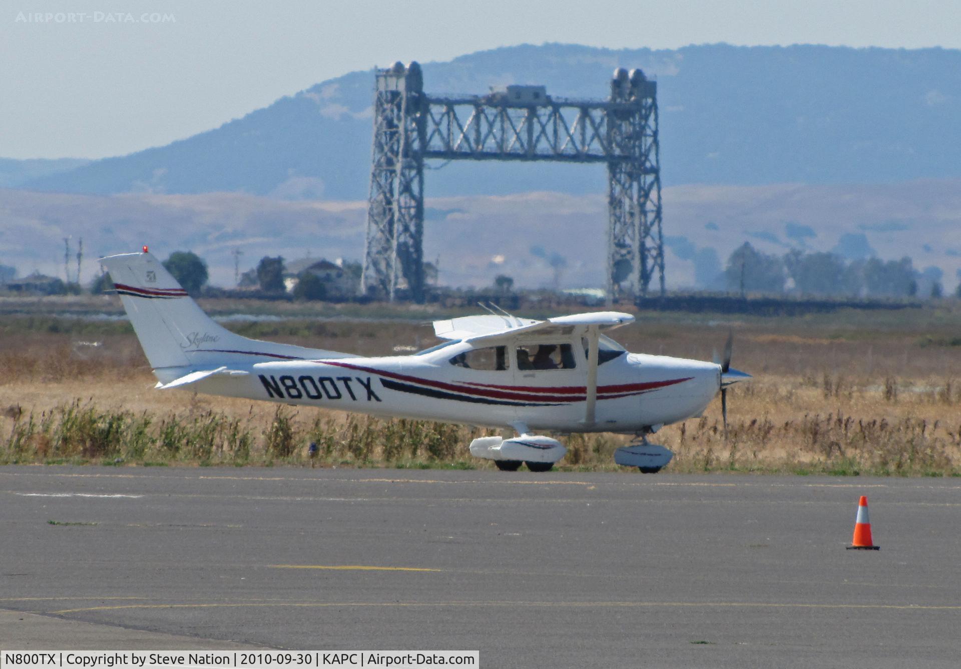 N800TX, 1999 Cessna 182S Skylane C/N 18280526, Framed against the Napa River RR bridge this 1999 Cessna 182S taxis for trip home to KCMA (Camarillo, CA)