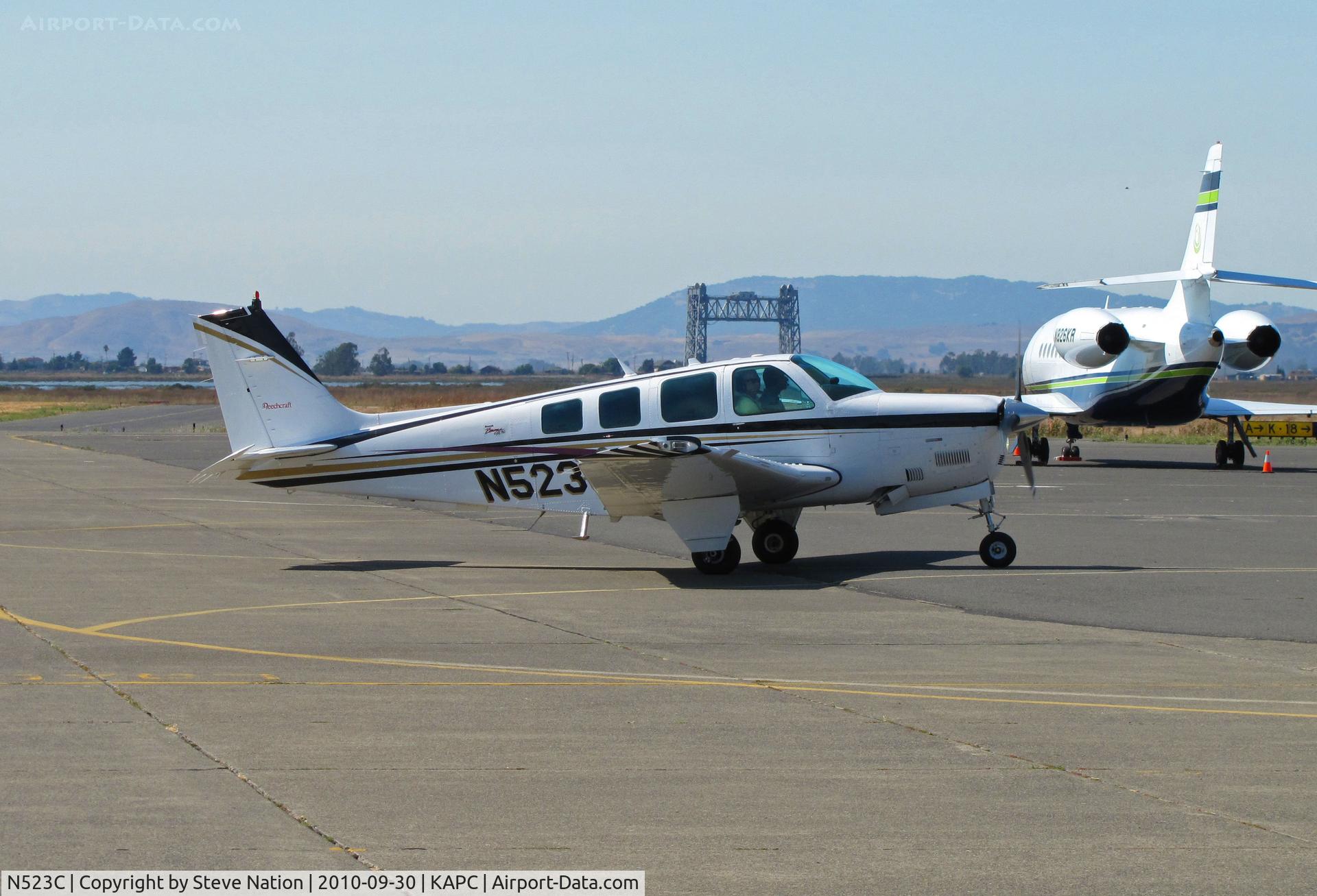 N523C, 1998 Raytheon Aircraft Company A36 Bonanza C/N E-3161, Framed by Napa River RR bridge this beautifully-maintained 1998 A36 on arrival from KPOC (Brackett Field Airport, La Verne, CA)