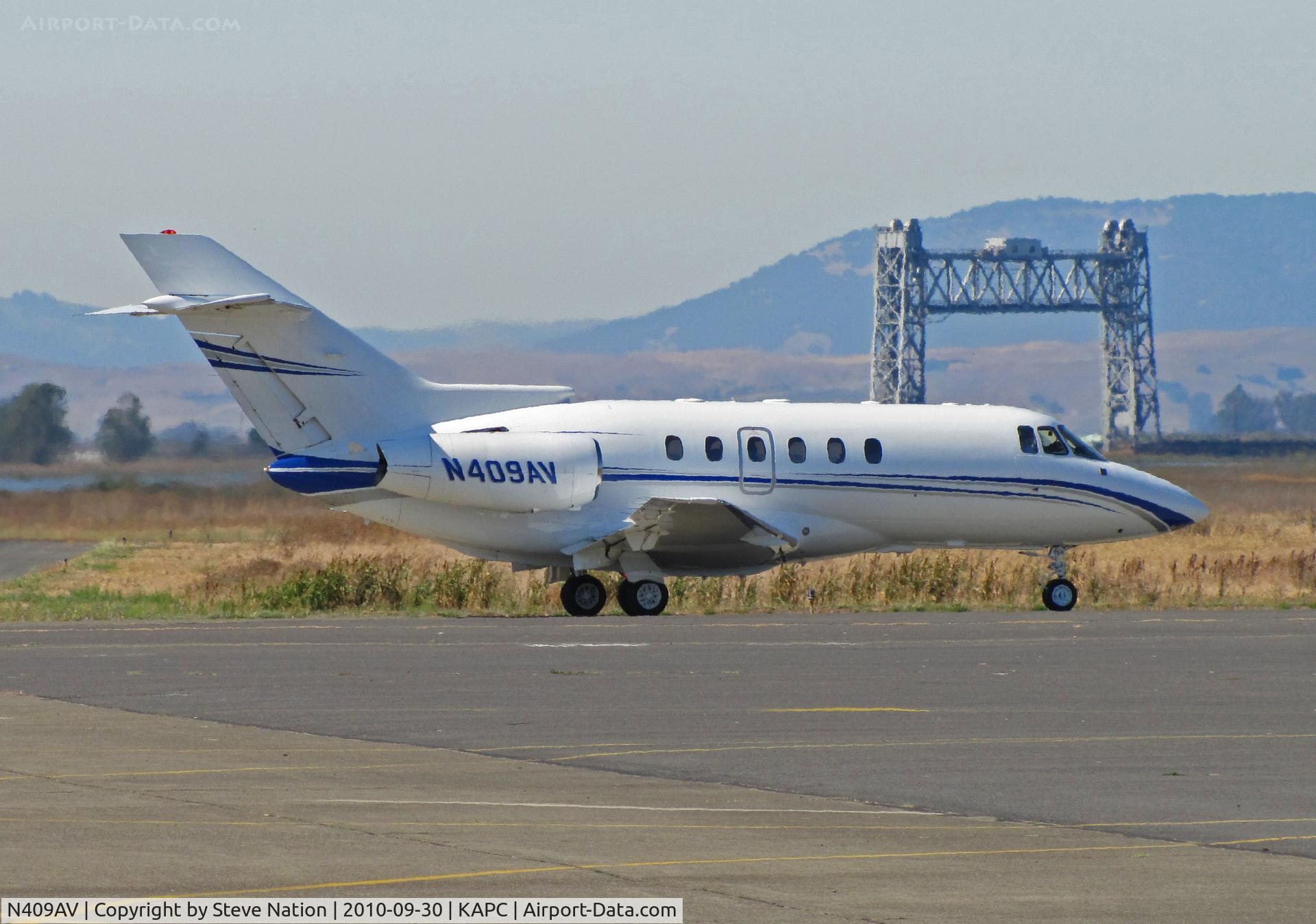 N409AV, 1998 Raytheon Hawker 800XP C/N 258347, Napa River RR bridge landmark frames this 1998 Hawker 800XP departing for parts unknown
