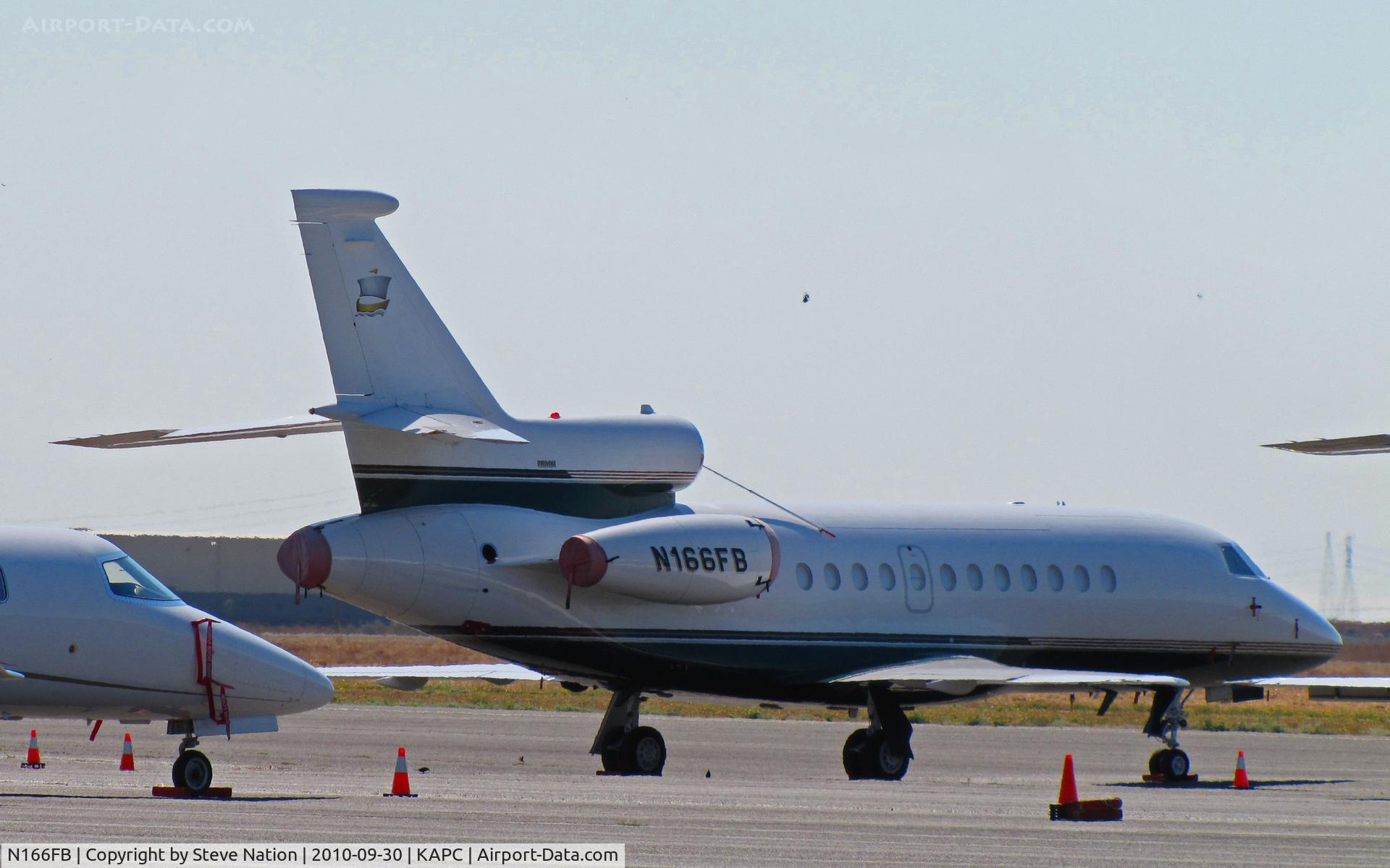 N166FB, 1997 Dassault Falcon 900EX C/N 18, Sailing ship tail logo adorns this 1997 Falcon 900 on heavy jet ramp at Napa, CA