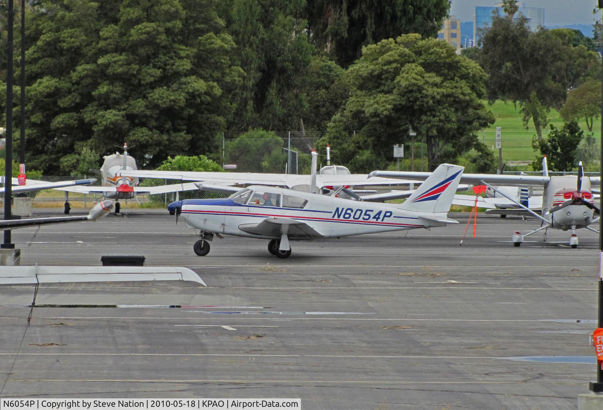 N6054P, 1959 Piper PA-24 C/N 24-1150, 1959 Piper PA-24 Comanche taxiing to vistors ramp at Palo Alto, CA