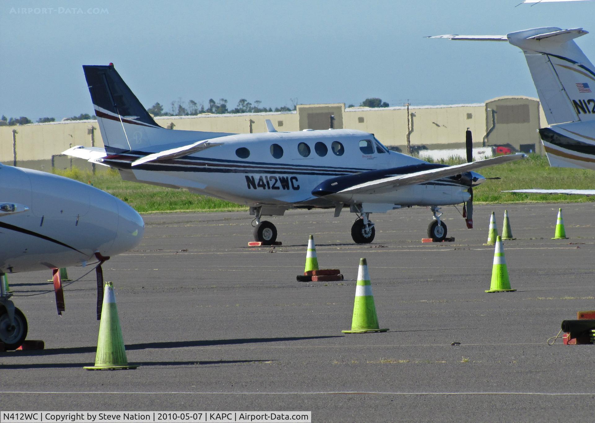 N412WC, Hawker Beechcraft Corp C90GTI King Air C/N LJ-1916, Surrounded by the yellow cones - Wilson Construction of Canby, OR operates this King Air C90GTI