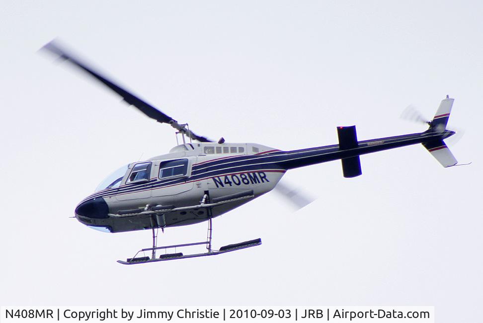 N408MR, 1978 Bell 206B C/N 2397, Seen oveflying the East River, NY on 3 Sep 10 outbound from Downtown Manhattan/Wall St. Heliport. Photo taken from RMS Queen Mary 2 berthed at Redhook, Brooklyn