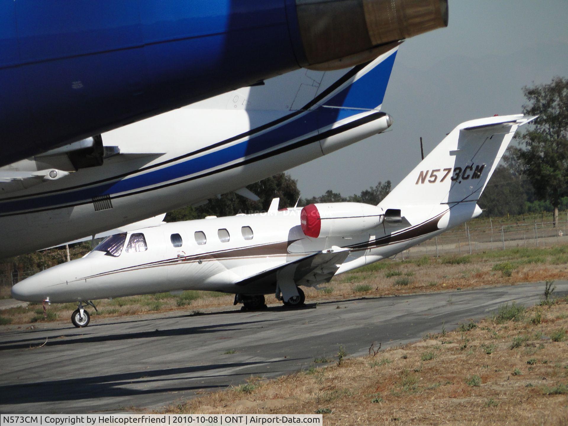 N573CM, 1999 Cessna 525 CitationJet CJ1 C/N 525-0352, Parked on the southside behind several other jets