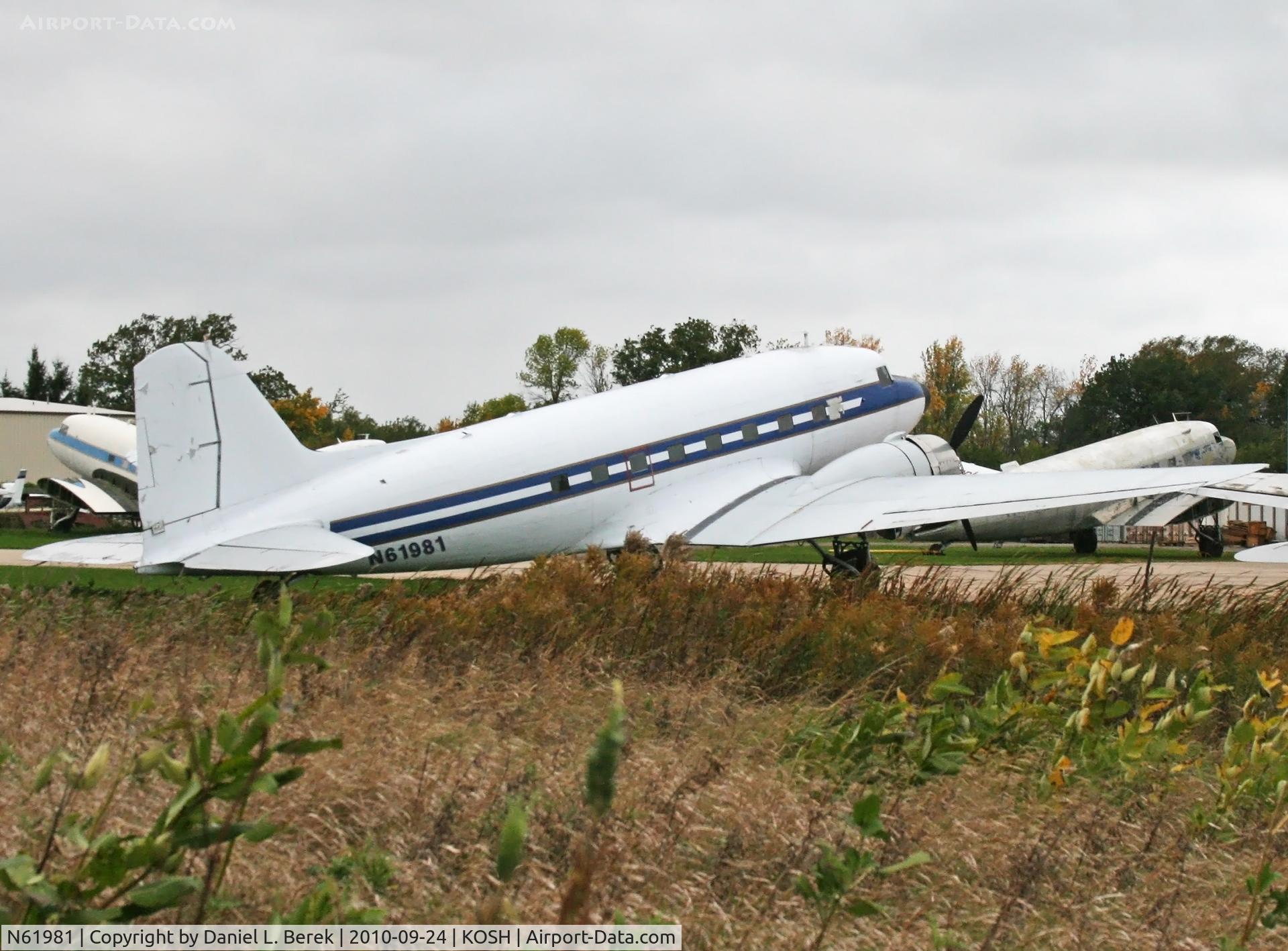 N61981, 1940 Douglas DC-3A C/N 2216, Built as a DST and delivered to American Airlines before the War, this beautiful bird awaits conversion or restoration at the Basler Turbo ramp.
