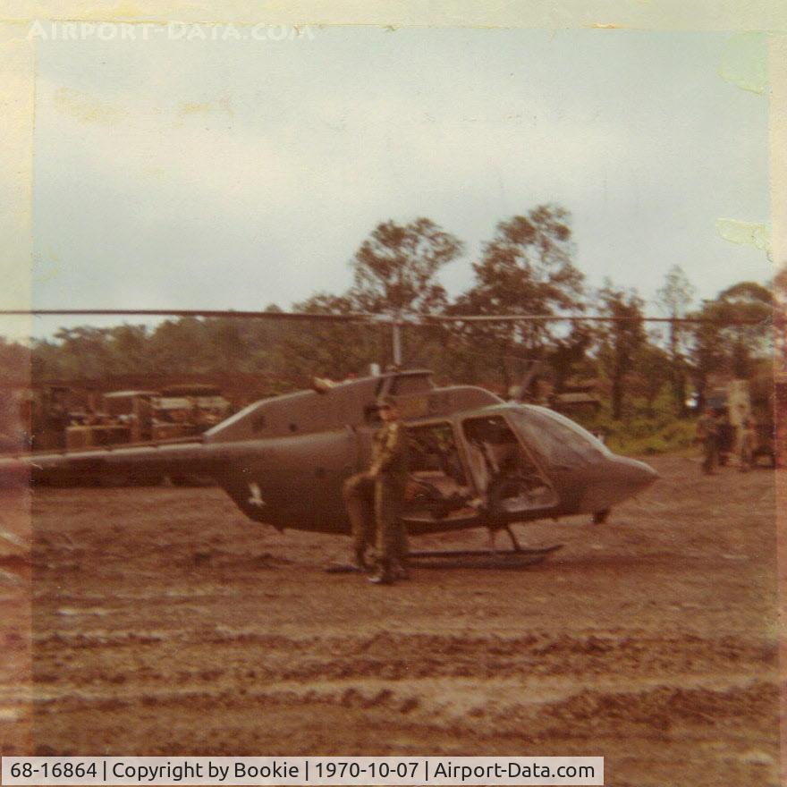 68-16864, 1968 Bell OH-58A Kiowa C/N 40178, 864 at Castle In The Sky, an Army Engineer base South of Dalat, Viet Nam, 1970.  Bullet damage is being assessed after taking heavy Viet Cong automatic weapons fire.