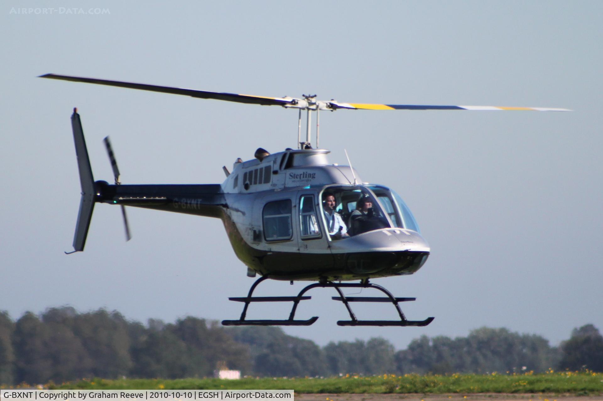 G-BXNT, 1977 Bell 206B JetRanger III C/N 2398, Landing at Norwich.