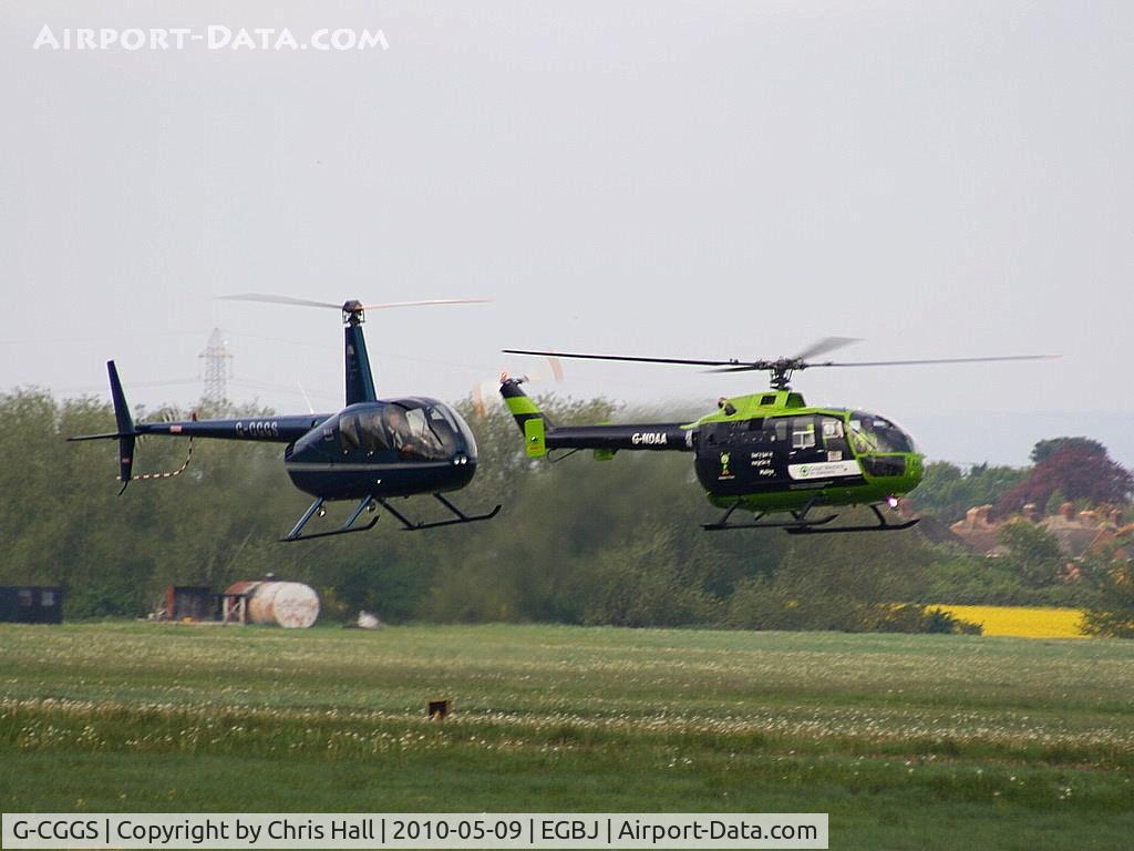 G-CGGS, 2009 Robinson R44 Raven II C/N 12967, Robinson R44 Raven II, G-CGGS with G-NDAA Bolkow BO 105DBS-4 in the background