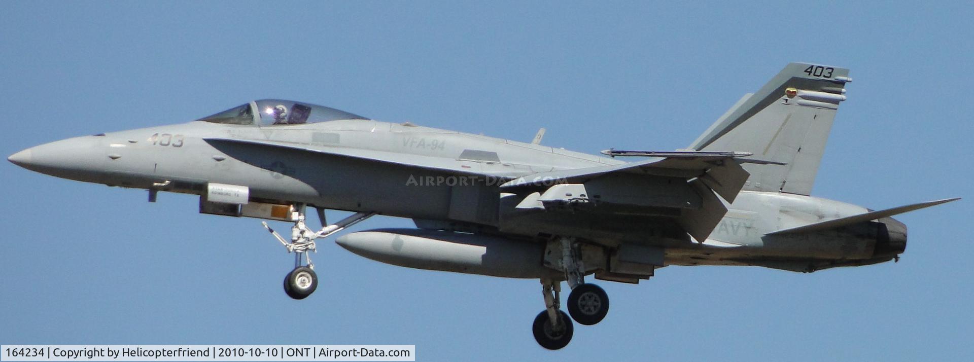 164234, 1991 McDonnell Douglas F/A-18C Hornet C/N 0997, Part of a four man formation flight over the races at Fontana and on final to runway 26R, from Squadron VFA-94
