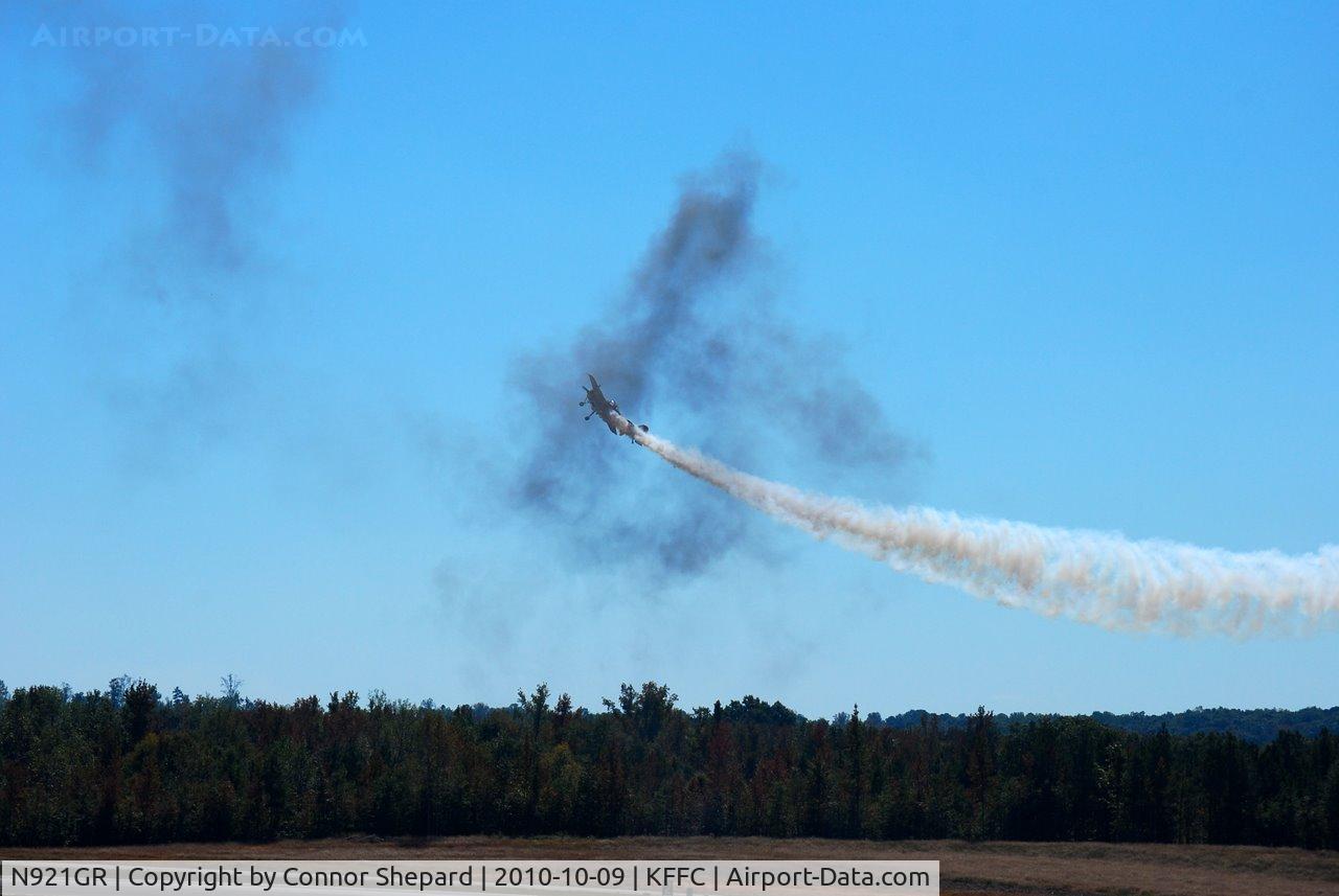 N921GR, 1993 Yakovlev Yak-55M C/N 930809, flying through smoke rings