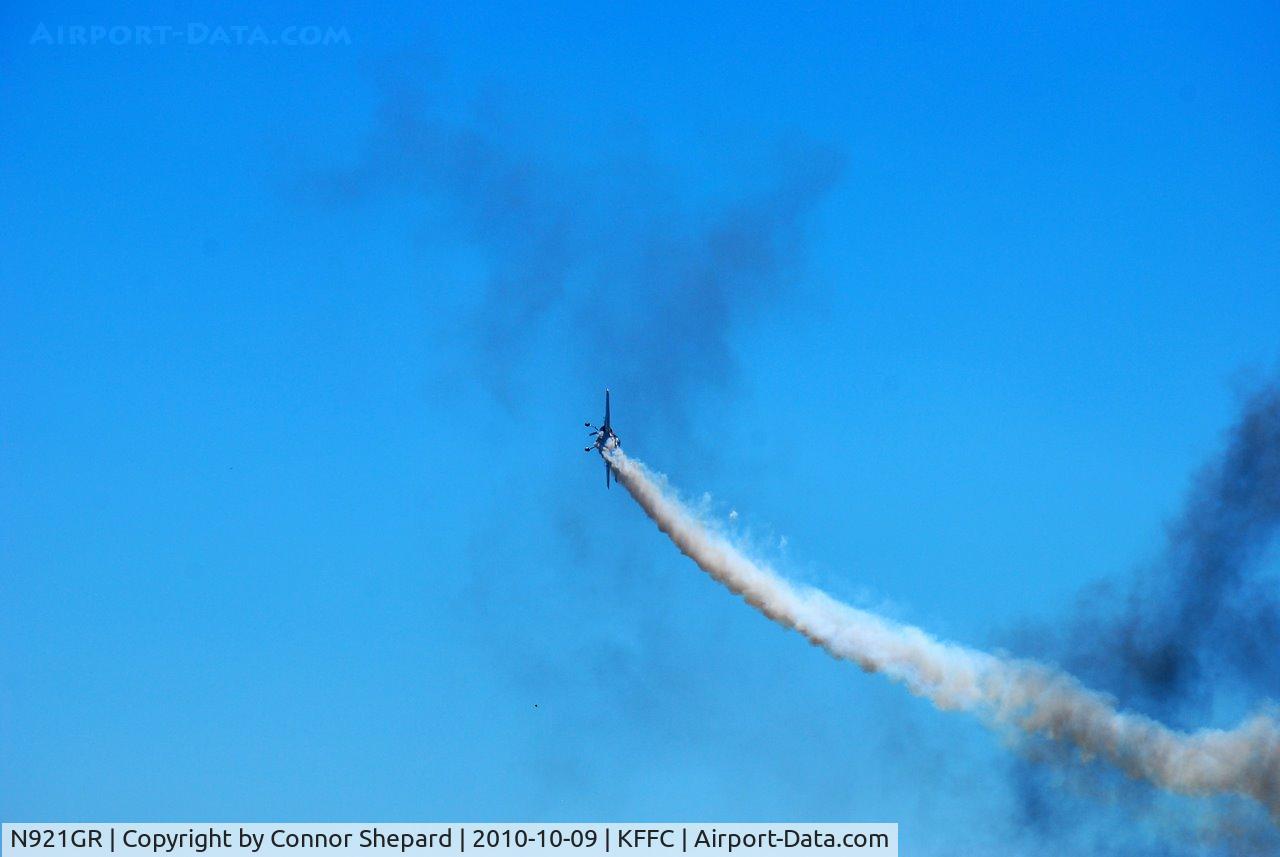 N921GR, 1993 Yakovlev Yak-55M C/N 930809, flying through smoke rings