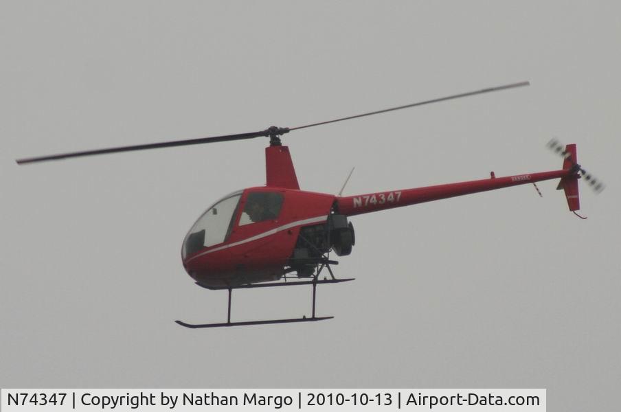 N74347, 2005 Robinson R22 Beta C/N 3759, Seen flying South over Ocean Beach Pier, San Diego, California.