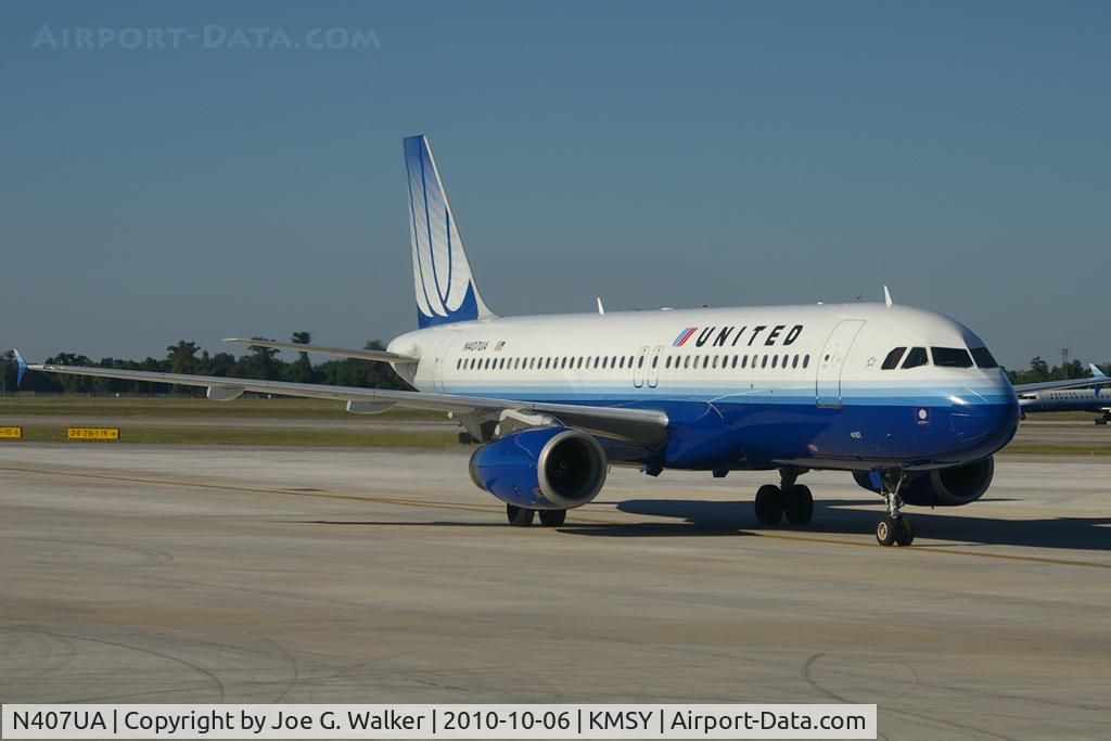 N407UA, 1994 Airbus A320-232 C/N 456, Seen taxiing to the gate is this former TED A320. Because of the overpaint on the TED logo and the light angle, a weird logo appeared on the tail, which somewhat resembles a merged CO & UA logo.
