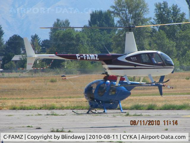 C-FAMZ, 2004 Robinson R44 II C/N 10359, ...R-44 hover-taxiing past a 