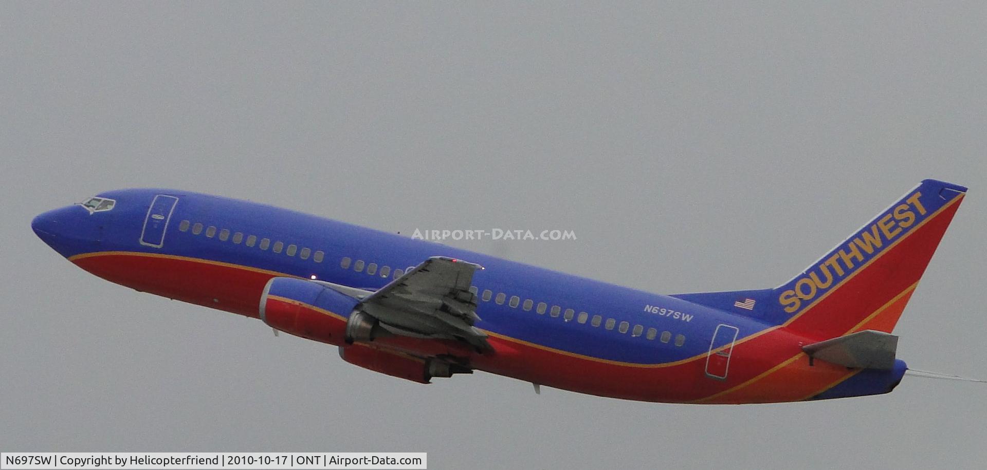 N697SW, 1988 Boeing 737-3TO C/N 23838, Just took off from runway 26R enroute to Las Vegas
