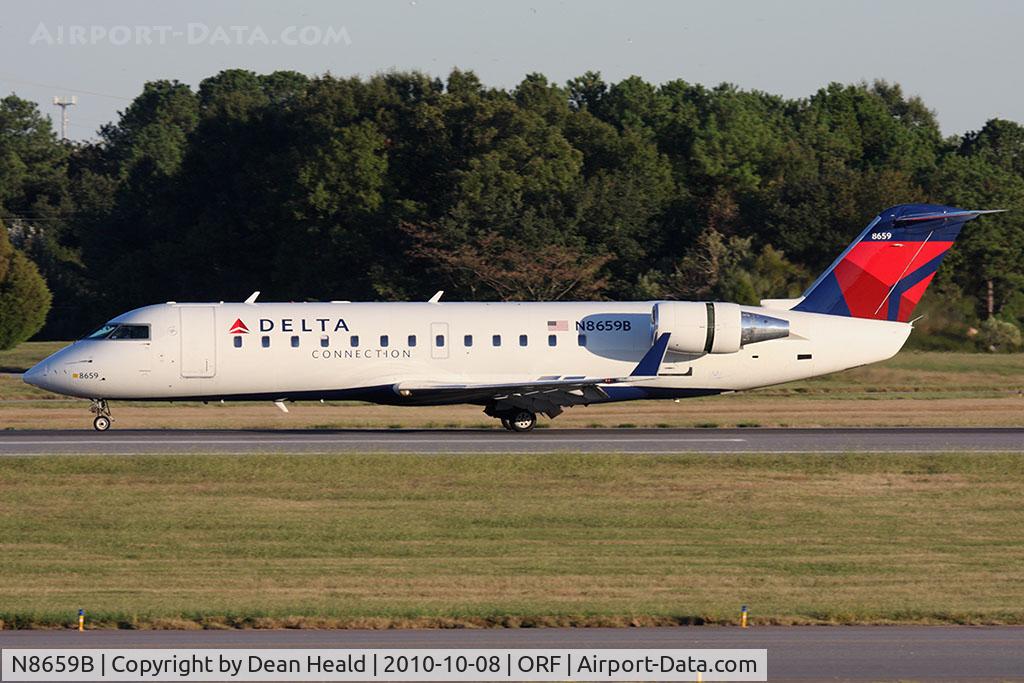N8659B, 2002 Bombardier CRJ-200 (CL-600-2B19) C/N 7659, Delta Connection (Pinnacle Airlines) N8659B rolling out on RWY 5 after arrival from John F Kennedy Int'l (KJFK) as Flight FLG4357. Seagulls were infiltrating the airport, sometimes Alfred Hitchcock-like.