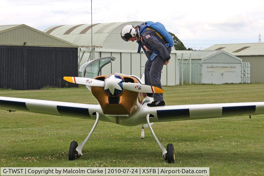 G-TWST, 2005 Silence Twister C/N PFA 329-14211, Peter Wells prepares to board his aerobatic Silence Twister at Fishburn Airfield, July 2010.